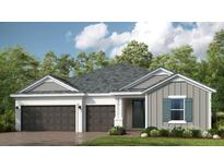 Charming single-story home featuring a three-car garage and neutral color palette with lush landscaping at 1711 Trailhead Ln, Zephyrhills, FL 33541