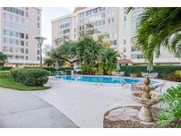 Community pool with lounge chairs and tables for outdoor enjoyment and relaxation at 2401 S Ardson Pl # 503, Tampa, FL 33629