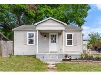 Charming single-story home features a covered front porch and a well-maintained lawn at 3413 N 12Th St, Tampa, FL 33605