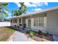 Charming front exterior of a single-story home with a well-manicured yard at 6505 Julie St, Tampa, FL 33610