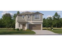 Charming two-story home featuring gray siding, a brown roof, a two-car garage, and a well-maintained front lawn at 13150 Empress Jewel Trl, Parrish, FL 34219