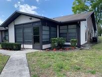 Charming single-story home with well-maintained landscaping and neutral exterior paint at 4558 Blossom Blvd # D, Zephyrhills, FL 33542