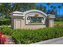 Community center sign surrounded by manicured landscaping, showcasing neighborhood amenities at 10144 Arbor Run Dr # 122, Tampa, FL 33647