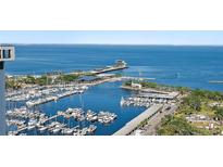 Breathtaking aerial view of a marina with yachts and city waterfront at 175 1St S St # 3008, St Petersburg, FL 33701