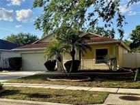 Charming single-story home with a two-car garage, mature landscaping, and inviting curb appeal at 224 Chardonnay Pl, Valrico, FL 33594