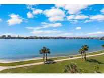 Expansive water view overlooking the city skyline, green space, and beautiful blue skies at 8020 Sailboat Key S Blvd # 101, St Pete Beach, FL 33707