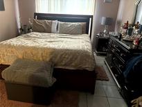 Comfortable bedroom with a large bed, soft lighting, and stylish furnishings at 1312 Foxboro Dr., Brandon, FL 33511