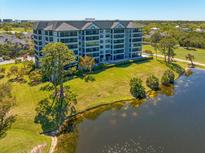 Beautiful condo with lake and golf course views from its spacious exterior grounds and well-maintained green space at 14810 Rue De Bayonne # 2D, Clearwater, FL 33762