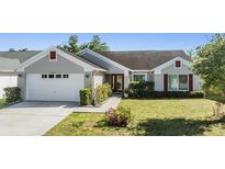 Charming single-story home with well-maintained lawn and beautiful landscaping at 1506 Lakehurst Way, Brandon, FL 33511