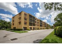 Spacious building with red awnings and a beautiful community view at 5849 Park N St # 308, St Petersburg, FL 33709