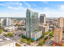 Stunning aerial view of a high-rise condo in a vibrant urban setting with clear blue skies at 777 N Ashley Dr # 2807, Tampa, FL 33602