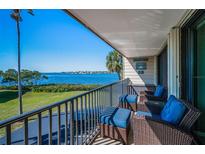 Relax on this inviting balcony with comfortable seating and breathtaking waterfront views at 2700 Bayshore Blvd # 9209, Dunedin, FL 34698