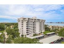 Elegant high-rise condo with multiple balconies, covered parking, and waterfront views on a sunny day at 30 Turner St # 502, Clearwater, FL 33756