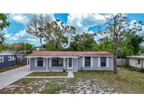 Charming single-story home features a covered porch and well-maintained front yard at 3407 N 48Th St, Tampa, FL 33605