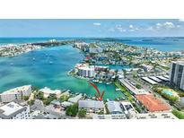 Breathtaking aerial view of waterfront property showcasing its prime location and stunning water views at 234 Dolphin Pt # 1, Clearwater Beach, FL 33767