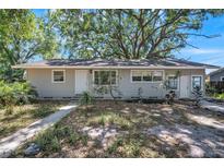 Charming single-story home featuring light grey siding and a well-maintained front yard at 503 W Lee St, Plant City, FL 33563
