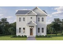 Charming two-story home with white siding, a gray roof, a well-manicured lawn and thoughtfully landscaped grounds at 621 37Th N Ave, St Petersburg, FL 33704