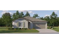 Charming single-Gathering home featuring a two-car garage, well-manicured lawn, and neutral-toned exterior at 10206 Gentle Rain Dr, Land O Lakes, FL 34638
