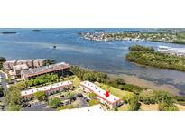 Scenic aerial view of a condo complex with waterfront access and lush landscaping at 2700 Bayshore Blvd # 532, Dunedin, FL 34698