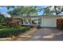 Charming single-story home with well-manicured landscaping and brick-paved driveway at 5533 97Th N Way, St Petersburg, FL 33708