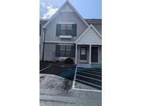 Charming townhouse exterior with gray siding, dark shutters, and convenient parking space at 3321 Laurel View Dr, Brandon, FL 33511