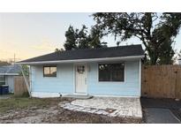 Charming home featuring a quaint entryway, simple design, and inviting facade at 1408 San Juan Ct, Clearwater, FL 33756