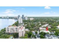 An aerial view shows a property nestled among mature trees and close to the waterfront at 2314 S Clewis Ct # 106, Tampa, FL 33629