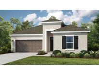 Charming single-Gathering home featuring a two-car garage, manicured lawn, and classic architectural details at 1880 Longliner Loop, Wesley Chapel, FL 33543