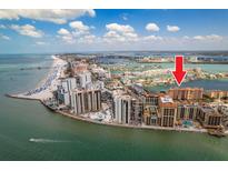 Aerial view showcases the building's location along the beach with close proximity to shopping and dining at 530 S Gulfview Blvd # 303, Clearwater, FL 33767