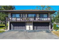 Two story home with a private second story balcony over a two car garage and an inviting curb appeal at 1836 Bough Ave # C, Clearwater, FL 33760