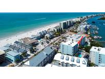 Enjoy the panoramic aerial view of the condo community near the beautiful beach at 19925 Gulf Boulevard # 502, Indian Shores, FL 33785