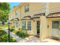 Charming two-story townhome with well-maintained landscaping and inviting front entrance at 2007 W De Leon St # C, Tampa, FL 33606