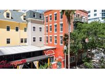 A vibrant view of the multi-colored building exteriors in a lively downtown area at 215 Central Ave # 4F, St Petersburg, FL 33701