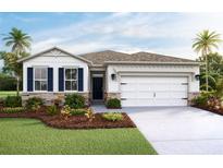 Charming single-Gathering home featuring a two-car garage, manicured lawn, and stone accents at 7775 Wheat Stone Dr, Zephyrhills, FL 33540
