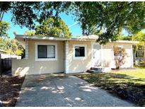 Charming home with a well-manicured lawn and inviting front entrance at 5211 Jersey S Ave, Gulfport, FL 33707