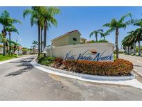 Community entrance to Vista Verde North featuring lush landscaping and signage at 6141 Bahia Del Mar Blvd # 129, St Petersburg, FL 33715