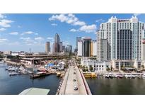 Stunning aerial view of the city, with boats, cars and beautiful cloudscape on clear day at 700 S Harbour Island Blvd # 813, Tampa, FL 33602
