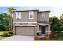 Inviting two-story home featuring a stone facade, attached two-car garage, and manicured landscaping at 10604 Dusty Boot Rd, Land O Lakes, FL 34638