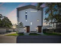 Modern exterior elevation with a clean design, contrasted by a well-manicured lawn at 1312 W Azeele St # 2, Tampa, FL 33606