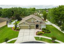 Beautiful single-story home with a well-manicured lawn and a two car garage, perfect for any Gathering at 30623 Bittsbury Ct, Wesley Chapel, FL 33543