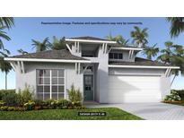 Inviting exterior of home featuring a two-car garage, modern design, and beautiful landscaping at 406 Sun Chaser Dr, Nokomis, FL 34275