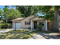 Charming single-story brick home with a well-manicured lawn and inviting curb appeal at 4824 16Th St, Zephyrhills, FL 33542