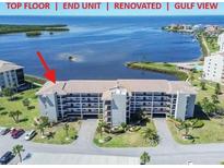 Beautiful waterfront condo featuring stunning Gulf views from a renovated end unit on the top floor at 8251 Brent St # 941, Port Richey, FL 34668