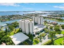 Stunning aerial view of luxury condominium complex surrounded by lush landscaping and beautiful waterfront views at 5940 Pelican Bay S Plz # 1105, Gulfport, FL 33707