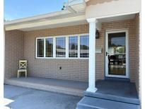 Inviting front porch with brick facade and classic column detail near the entryway at 6221 13Th N Ave, St Petersburg, FL 33710
