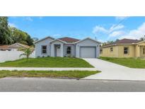Charming single-story home with well-manicured lawn and inviting curb appeal at 8505 N Brooks St, Tampa, FL 33604