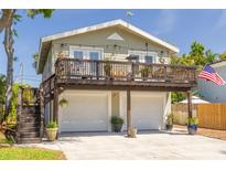 Charming home with two-car garage and upper deck at 224 Ontario Ave, Crystal Beach, FL 34681
