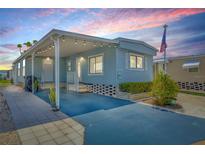 Charming single-story home with a covered carport, and cozy front yard, perfect for relaxing evenings at 9790 66Th N St # 160, Pinellas Park, FL 33782