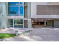 The building entrance shows a contemporary design with an entrance to the parking garage at 111 N 12Th St # 1614, Tampa, FL 33602
