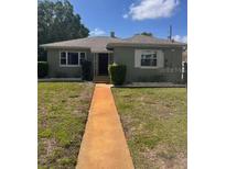 Charming single-story home with a well-maintained front yard and a walkway to the front door at 120 27Th Ne Ave, St Petersburg, FL 33704